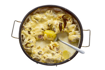 Ready dish of potatoes with bacon and cheese sauce