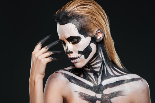 Portrait of woman with blonde hair and halloween skeleton makeup