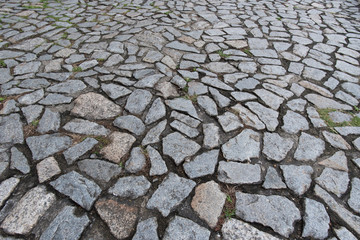 Cobble stone floor on sidewalk - texture background, focus on foreground.