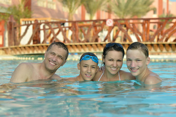 Happy family having  in pool