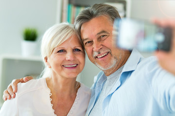 Fototapeta premium Senior couple taking selfie 