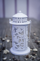 Decorative white garden lamp with candle