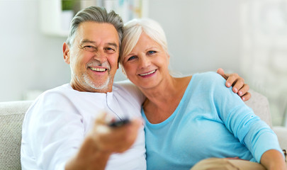 Fototapeta premium Senior couple with remote control 