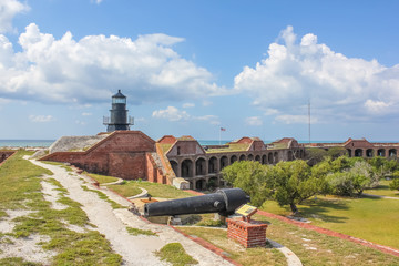 The Garden Key Lighthouse and cannon atop Fort Jefferson in the Dry Tortugas National Park,...