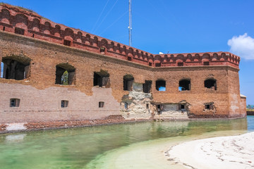 The Dry Tortugas National Park consists of seven tiny islands composed of coral reefs, white sandy beaches and the tropical waters. Fort Jefferson is a historic military fortress in the Dry Tortugas.