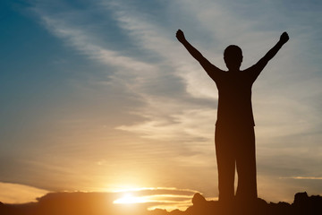 Fototapeta premium silhouette of woman pointing with finger in sky