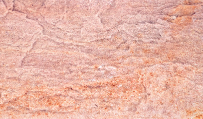 Red rough stone pavement texture background