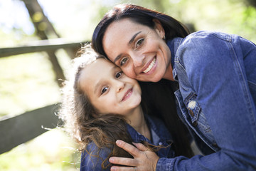 Portrait of happy mother and daughter outdoor