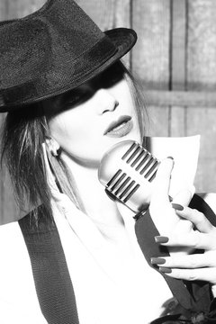 retro woman singing into microphone