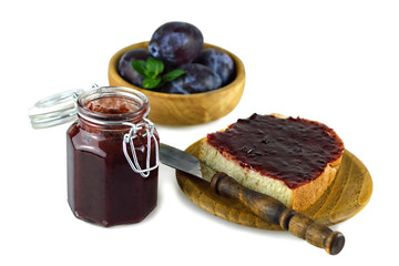 Homemade plum jam for breakfast, isolated on white
