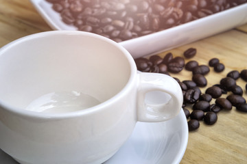 Obraz na płótnie Canvas Empty coffee cup and coffee bean.