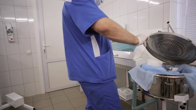 Doctor is preparing the tools for surgery