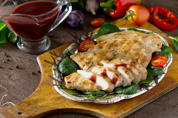 Fried chicken fillet with grilled tkemali (plum sauce) and mix g