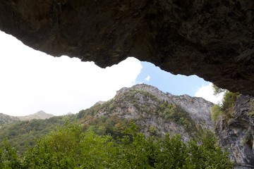 mountains forming a crack in the blue sky