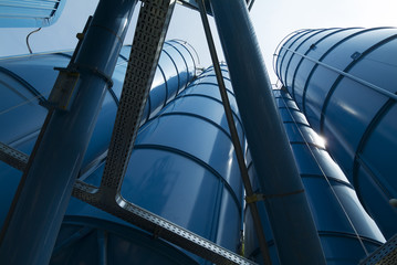 Naklejka premium View from below of Tower Silos Bulk Storage