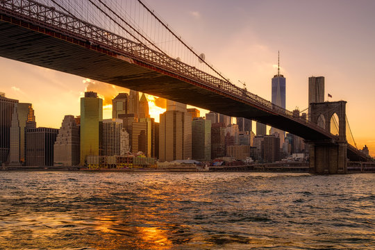 Sunset in New York with a view of the Brooklyn Bridge and Lower Manhattan © kmiragaya