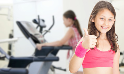 little girl athlete in fitness hall