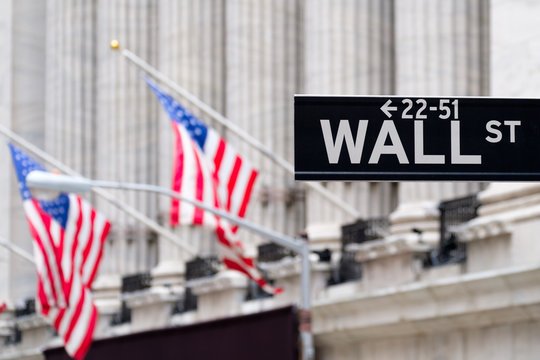 Fototapeta Wall street sign with the New York Stock Exchange on the background