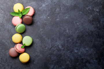 Colorful macaroons on stone table