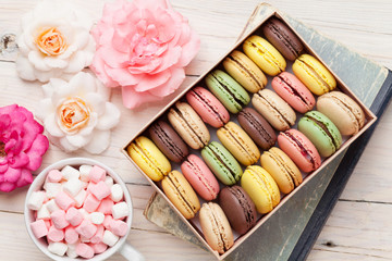 Colorful macaroons in a box and marshmallow