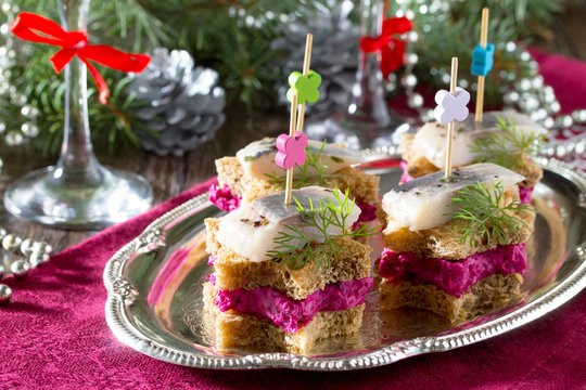 Holiday appetizer: Canapes in the form of a star with pickled he
