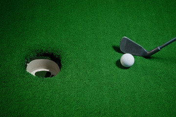 Golf ball and Golf Club on Artificial Grass vignetted