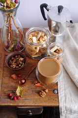 Still life with coffee, nuts and small apples