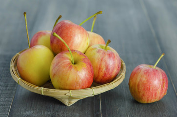 Red and yellow apple   on wooden background