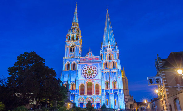 The illuminated Our Lady of Chartres cathedral, France.