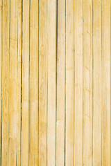 Fototapeta premium texture of old yellow paint on wooden boards