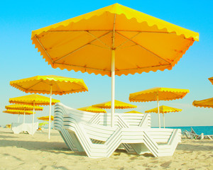 yellow parasol and sun lounger