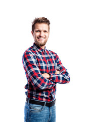 Fototapeta premium Hipster man in jeans and shirt, studio shot, isolated