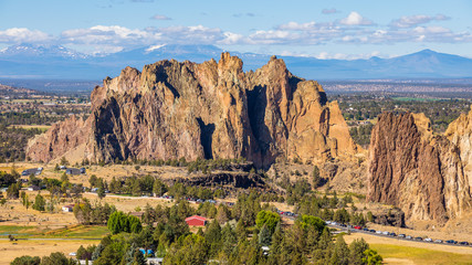 River flowing in the valley against the background of sharp rocks. Beautiful landscape of yellow sharp cliffs. Smith Rock state park, Oregon