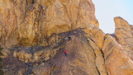 Climbers on the wall. Beautiful landscape of yellow sharp cliffs. Smith Rock state park, Oregon