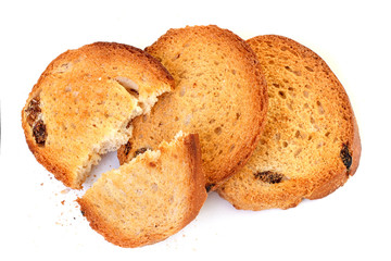 Portion of sweet dry hard bread chucks crackers with raisins