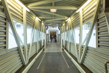 Papier Peint photo Tunnel Covered bridge at ferry
