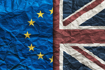 Brexit, flags of the United Kingdom and the European Union on crumpled paper background. Referendum 2016. Vertical split frame. 