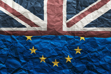 Brexit, flags of the United Kingdom and the European Union on crumpled paper background. Referendum 2016. Horizontal split frame. 