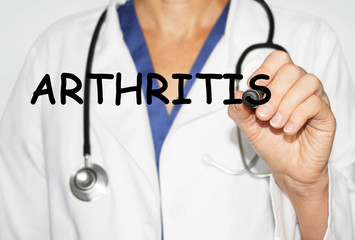 Doctor writing word Arthritis, Medical concept