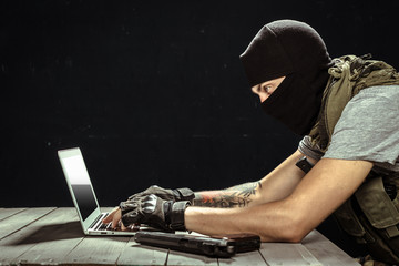 Terrorist working on his computer