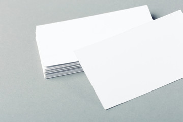 blank business cards on grey background