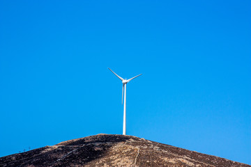 Wind turbine on a hill