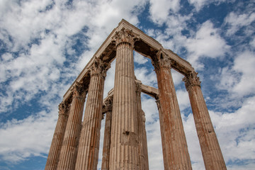 Ancient structure below blue sky with white clouds