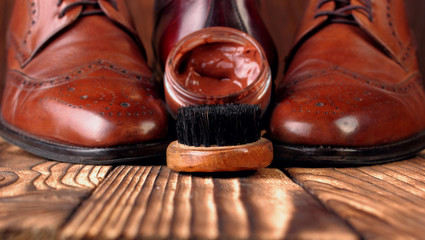 Brush and cream for shoes .Defocused shoes brogues