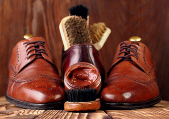 Brush and cream for shoes .Defocused shoes brogues