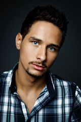 Handsome bearded man wearing shirt, portrait shot in studio