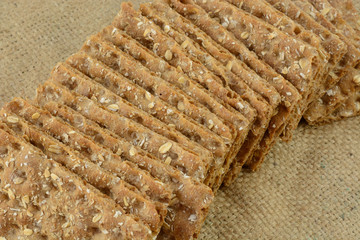 Multi grain whole grain crispbread crackers on burlap