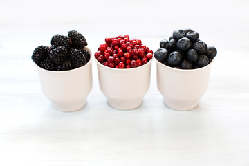 Berries on Wooden Background.