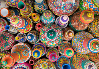 Top view showing a composition of artistic painted handcrafted pottery jars