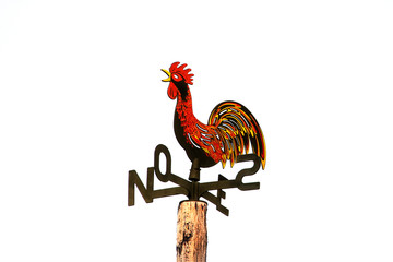 Wind rooster on the roof © zoranlino